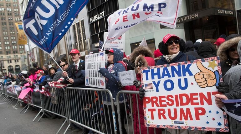 Supporters of President Donald Trump take part in a rally on...