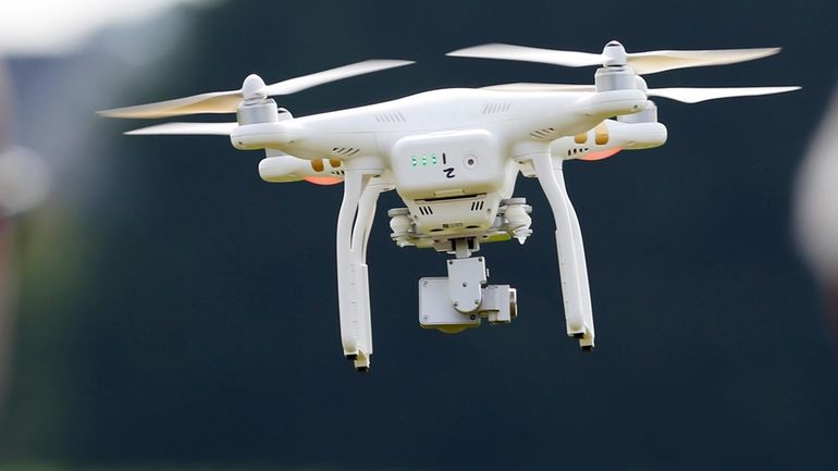 A DJI Phantom 3 drone flies during a drone demonstration...