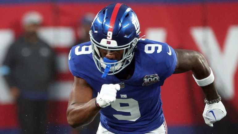 Malik Nabers of the Giants runs down the field during...