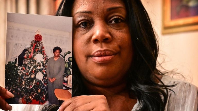 Nykiah Morgan of Westbury with a photograph of her mother, Dororthy...