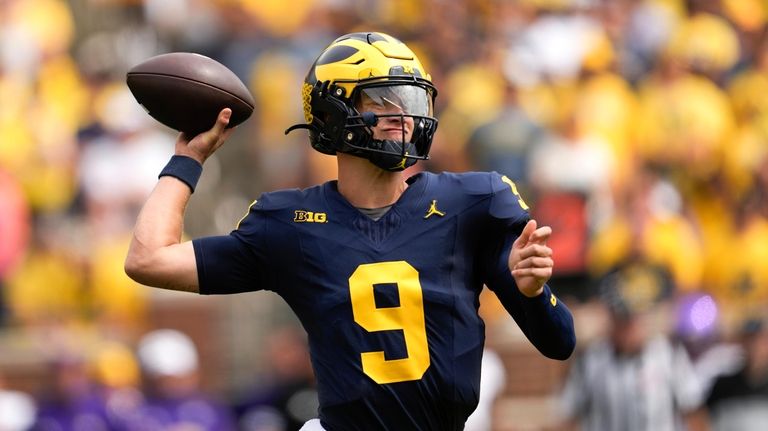 Michigan quarterback J.J. McCarthy throws against East Carolina in the...