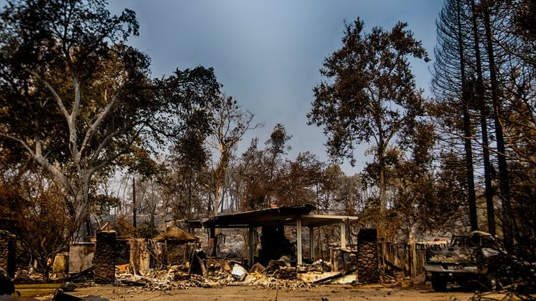 A home and truck in ruin after the Park Fire...