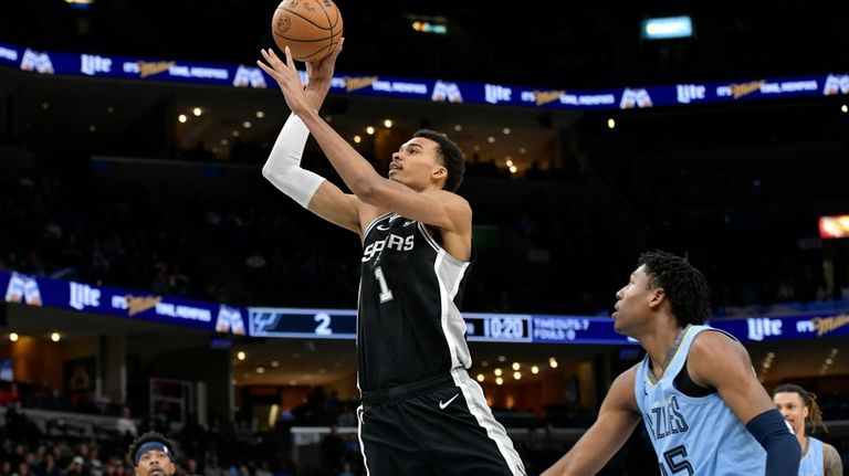 San Antonio Spurs center Victor Wembanyama (1) shoots in front...