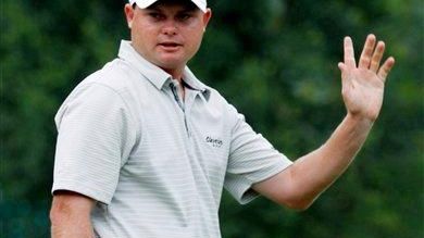 Ted Potter Jr. waves to the crowd as he celebrates...