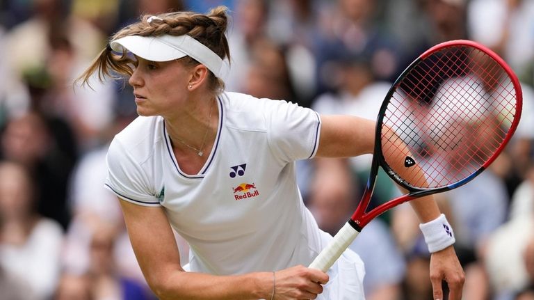 Elena Rybakina of Kazakhstan serves to Elina Svitolina of Ukraine...