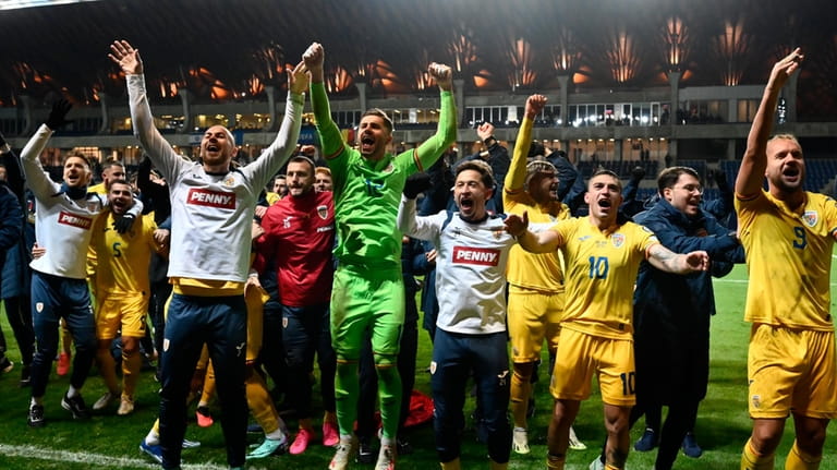 Romania's players celebrate at the end of the Euro 2024...