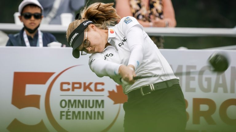 Canada's Brooke Henderson hits a tee shot on the 18th...