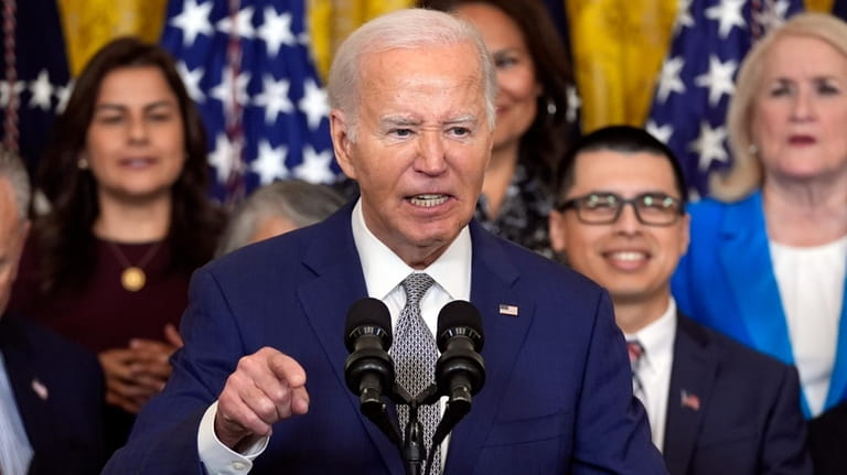 President Joe Biden speaks during an event marking the 12th...