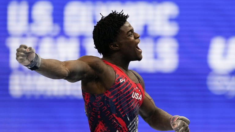 Frederick Richard celebrates after competing on the pommel horse at...