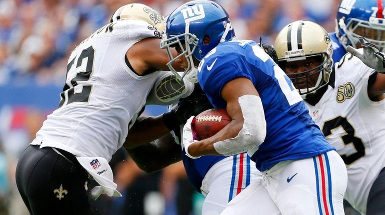 Rashad Jennings #23 of the New York Giants runs the...