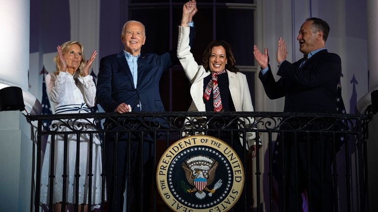 First lady Jill Biden, left, and second gentleman Douglass Emhoff,...