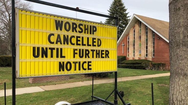 A sign outside Wantagh Memorial Church on Bellmore Avenue on Wednesday,...