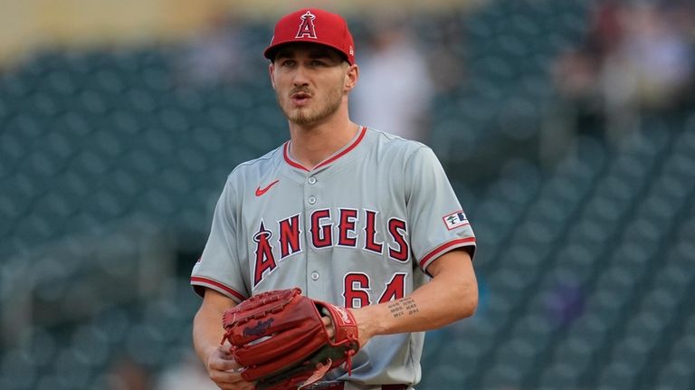 Los Angeles Angels starting pitcher Jack Kochanowicz reacts after a...