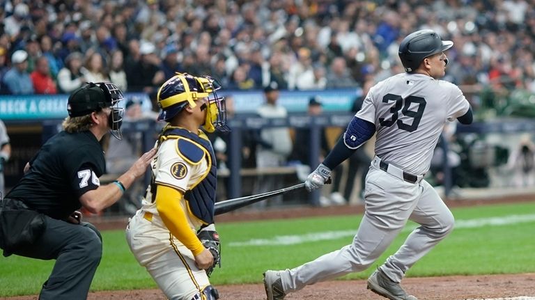 New York Yankees' Jose Trevino hits a two-run scoring single...