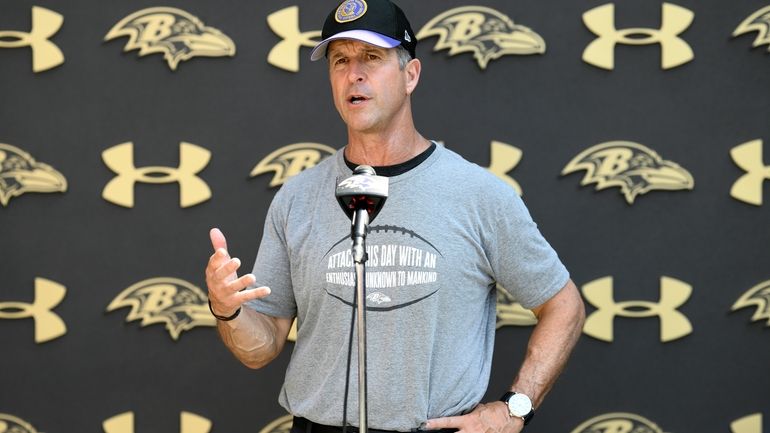 Baltimore Ravens head coach John Harbaugh speaks to the media...