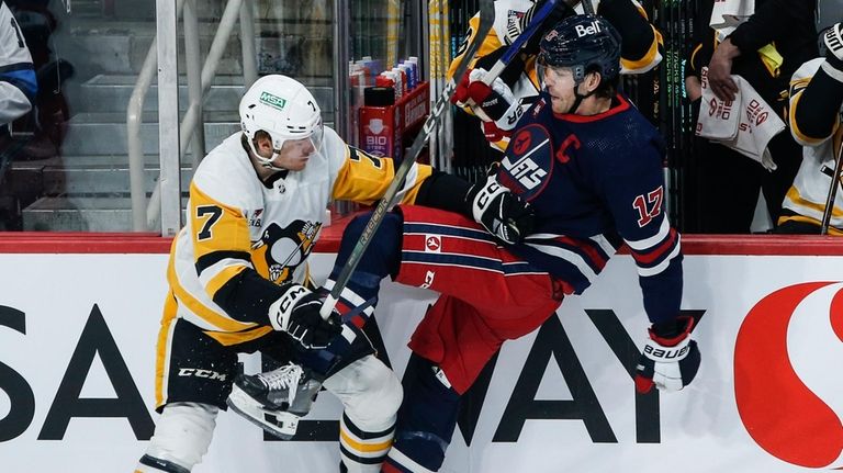 Winnipeg Jets' Adam Lowry (17) and Pittsburgh Penguins' Vladislav Namestnikov...