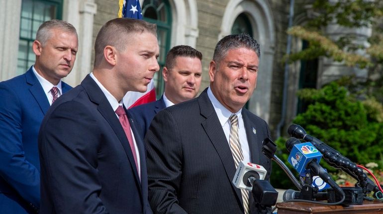 Nassau County Legis. Joshua Lafazan, left, with Nassau County Police Benevolent Association...