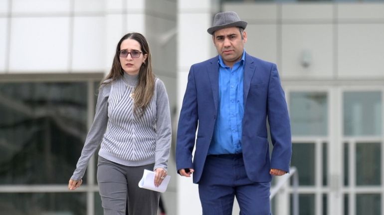 Diana Fuzailov and Eduard Yusupov leave federal court in Central Islip Thursday...