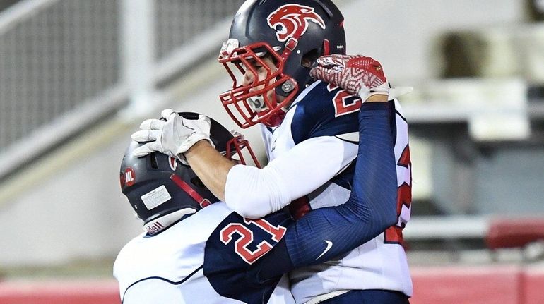 Miller Place's Coleton Reitan, left, congratulates Anthony Filippetti after he...