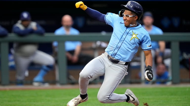 Tampa Bay Rays' Richie Palacios slides home to score on...