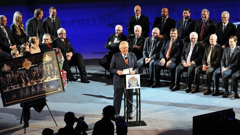 Glen Sather speaks during ceremonies honoring him at Rexall Place...