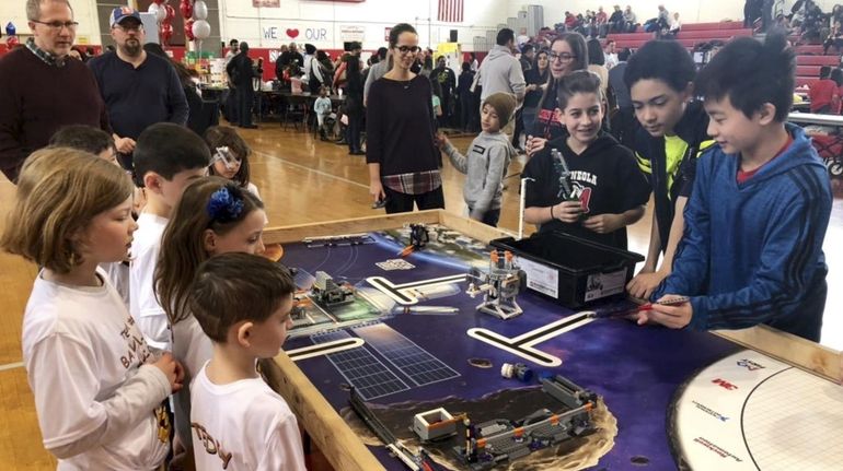 Sixth- and seventh-graders from Mineola Middle School share their robotics...