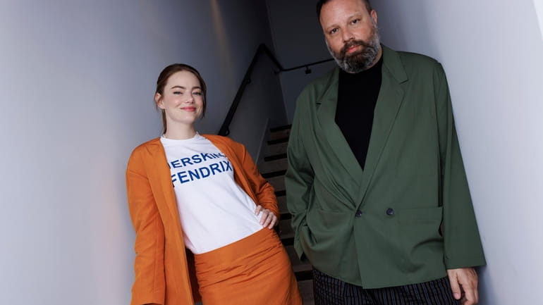 Emma Stone, left, and director Yorgos Lanthimos pose for a...