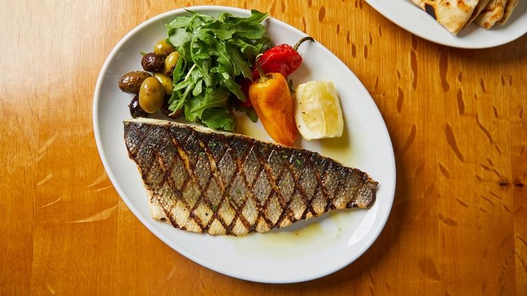 Branzino filet with arugula at Calissa in Watermill.