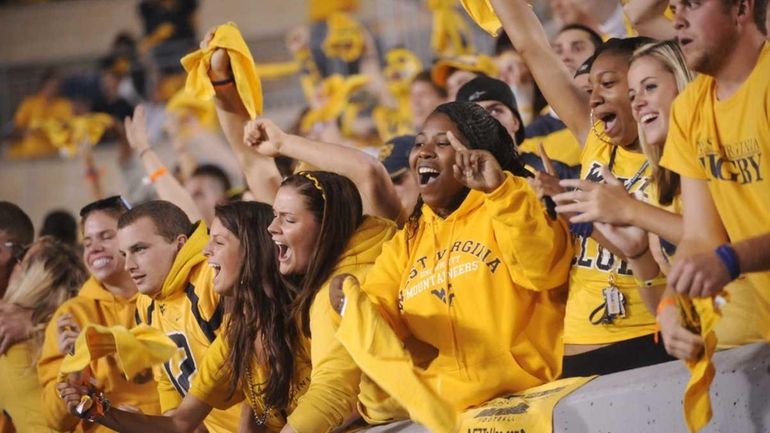 West Virginia fans celebrate during a NCAA college football game...