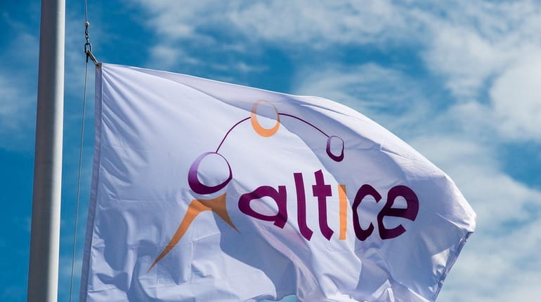 The Altice flag being raised in place of the Cablevision...