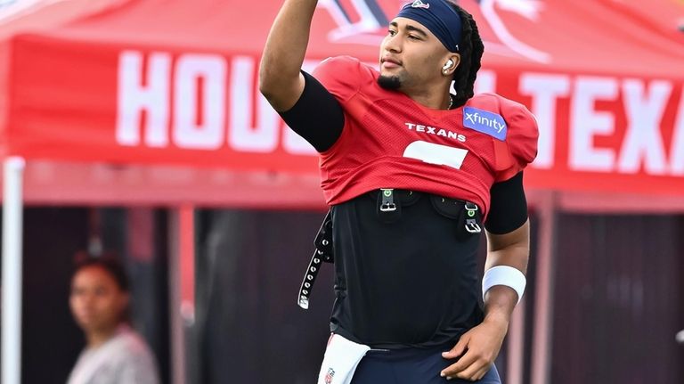 Houston Texans quarterback C.J. Stroud waves to the fans during...