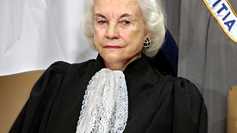 Supreme Court Associate Justice Sandra Day O'Connor listens to remarks...