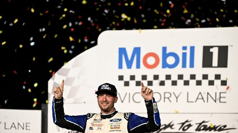 Chase Briscoe celebrates in Victory Lane after winning a NASCAR...