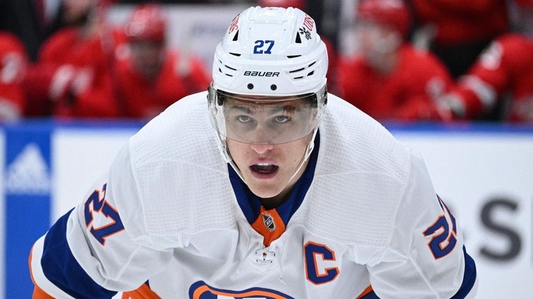 Islanders left wing Matt Martin sets before a face-off against...