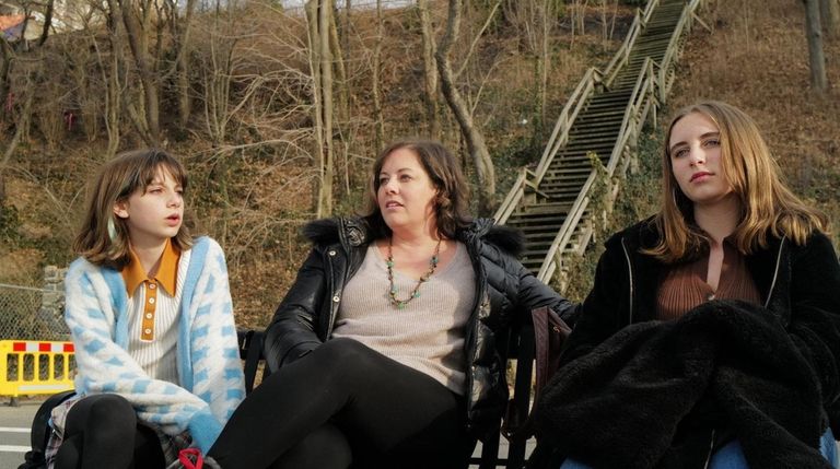 Kayte Camarata, of Huntington, and her daughters Liva, 14, Caleigh,...