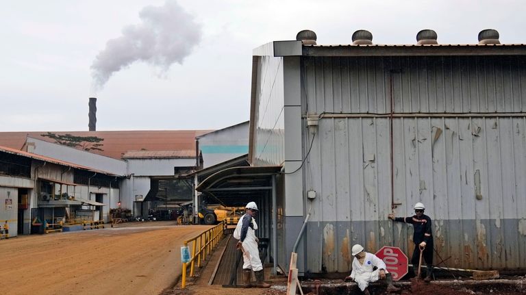 Workers take a break at PT Vale Indonesia's nickel processing...