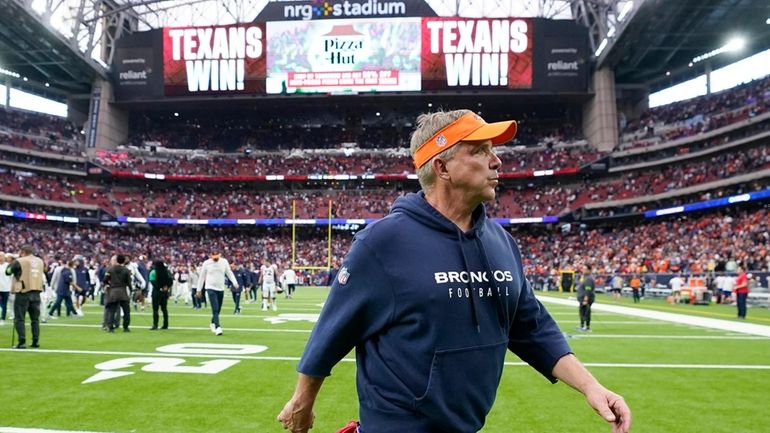 Denver Broncos head coach Sean Payton leaves the field after...