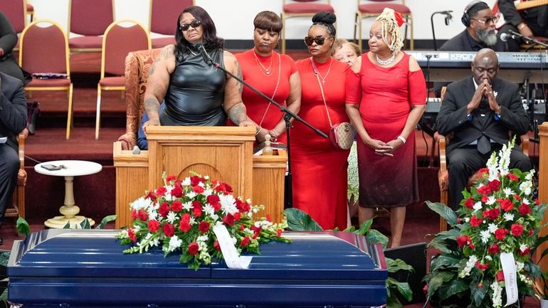 DeAsia Harmon speaks at the funeral for her husband D'Vontaye...