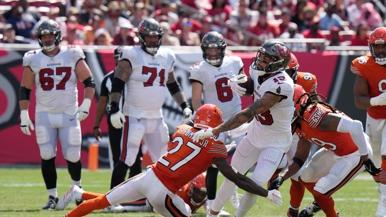 Tampa Bay Buccaneers wide receiver Mike Evans (13) is stopped...