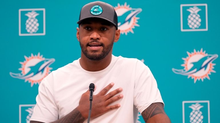 Miami Dolphins quarterback Tua Tagovailoa speaks during a news conference...