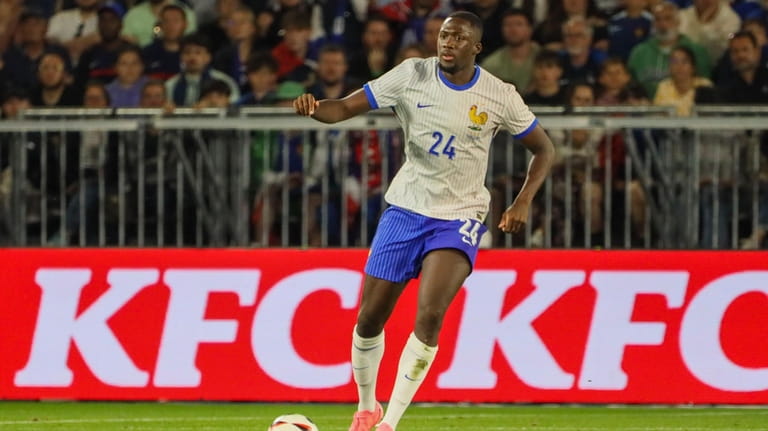 France's Ibrahima Konate controls the ball during the international friendly...