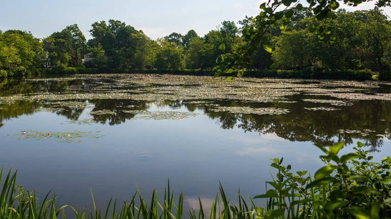 Mirror Lake in Brightwaters shown Monday. Village officials are imploring residents to...