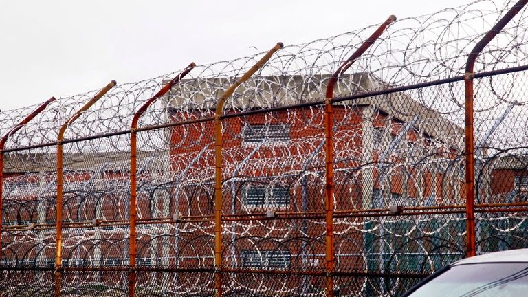 In this March 16, 2011, file photo, a security fence...