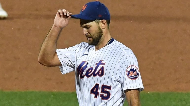 Mets starting pitcher Michael Wacha stands on the mound after...