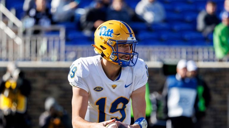 Pittsburgh's Nate Yarnell (19) carries the ball during the first...