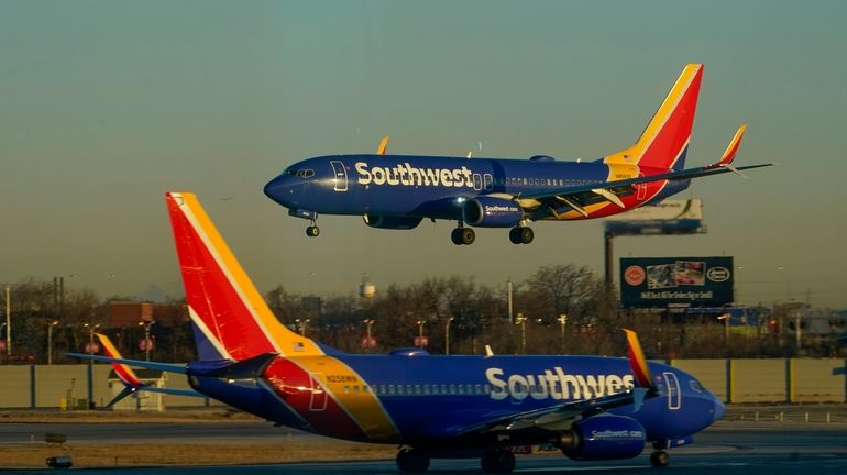 A Southwest Airlines plane prepares to land at Midway International...