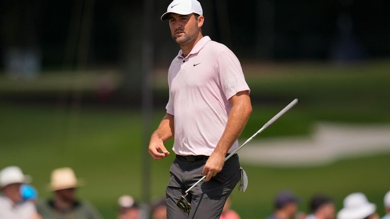 Scottie Scheffler walks on the fifth green during the second...