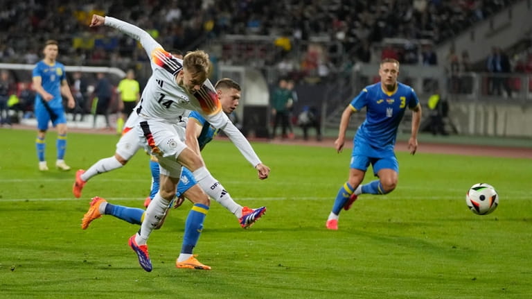Germany's Maximilian Beier makes an attempt to score during an...