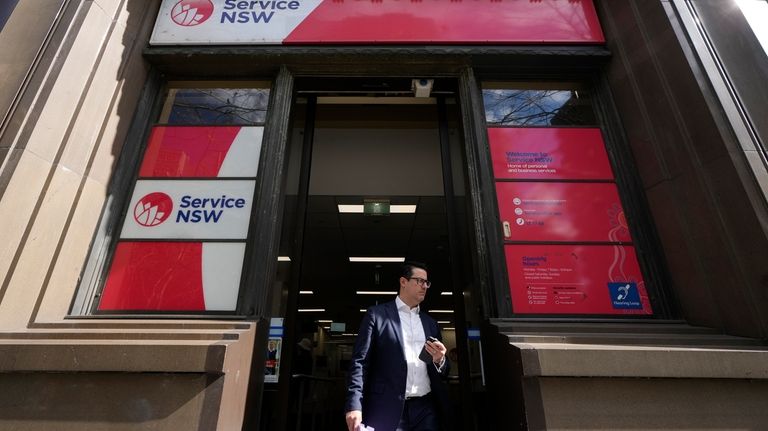 A man walks out of a Services New South Wales...