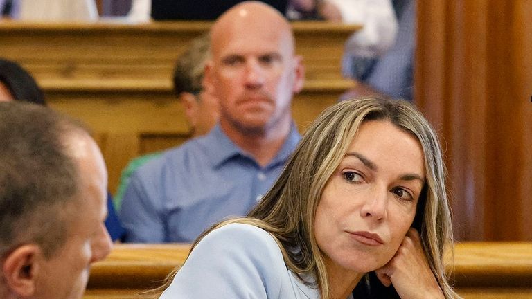 Karen Read listens to her attorney, Martin Weinberg, who was...